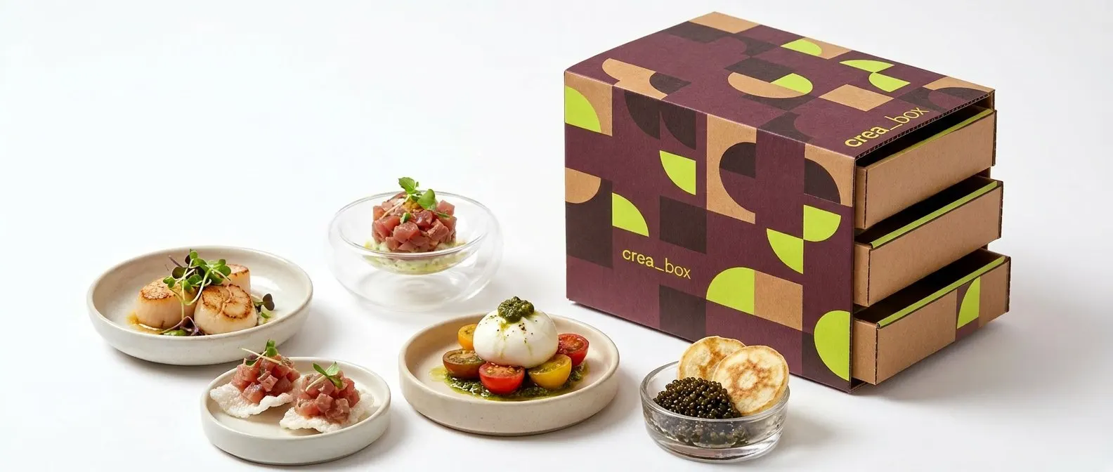 Box crea_box abierta junto a platos con las referencias gourmet